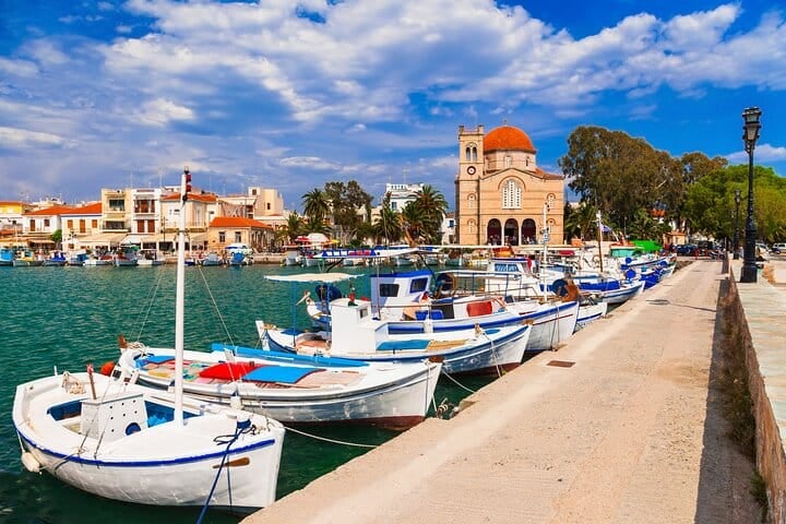 Fishing boats moored beside Aegina’s waterfront promenade