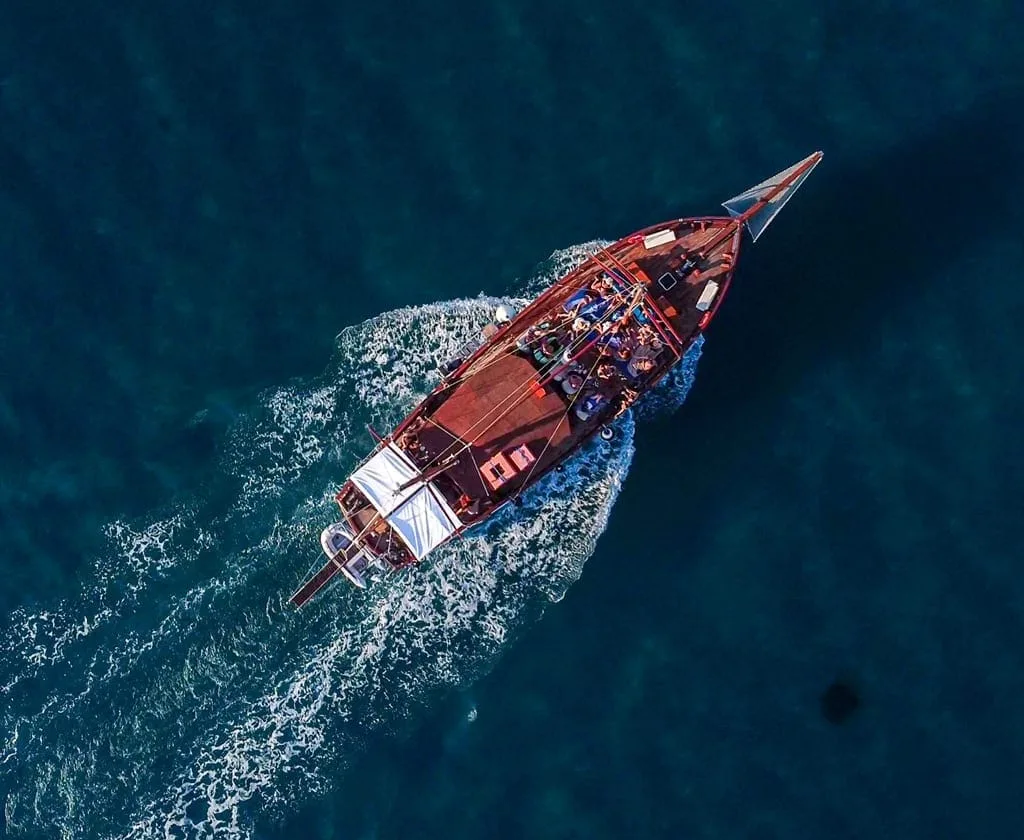 Aerial view of a wooden cruise boat, used as the video cover