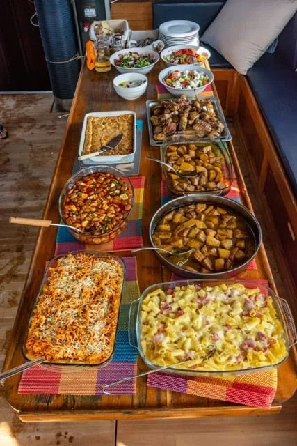 The onboard lunch buffet laid out on a wooden table